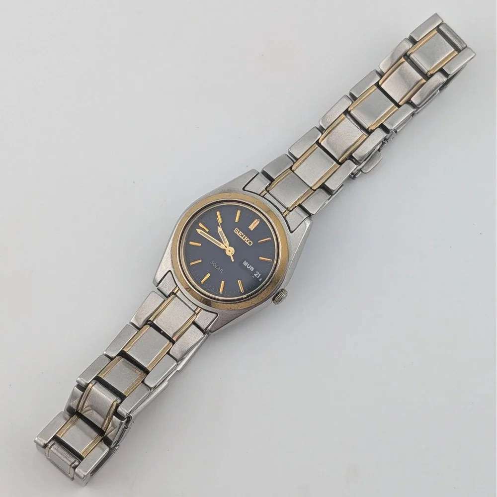 Seiko Solar V138-0AA0 Blue Sunburst Day/Date Two Tone Women's 25mm Watch